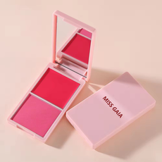 Pink blush compact with custom logo printing example, showcasing branding services for private label cosmetic clients.