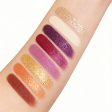 High pigment eyeshadow arm swatches showing matte, shimmer, and metallic finishes. Wholesale makeup supplied by MCcosme.