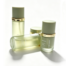 Custom matte green glass packaging for hydration toner and serum produced in GMP facility