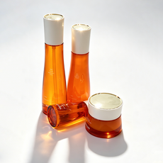 Wholesale custom orange glass cosmetic bottles and cream jar packaging samples from factory