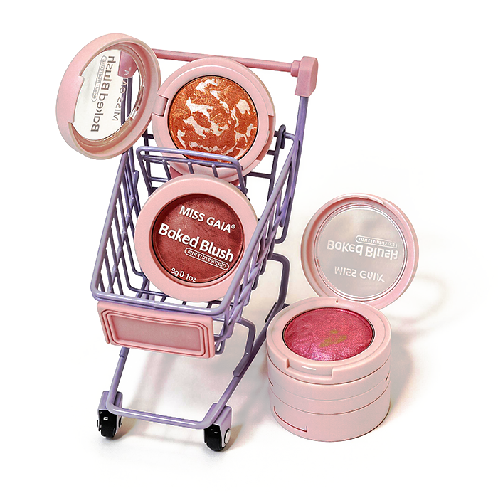 Creative shot of branded baked blushes in miniature shopping cart, symbolizing ready-to-ship stock availability for dropshipping or retail.