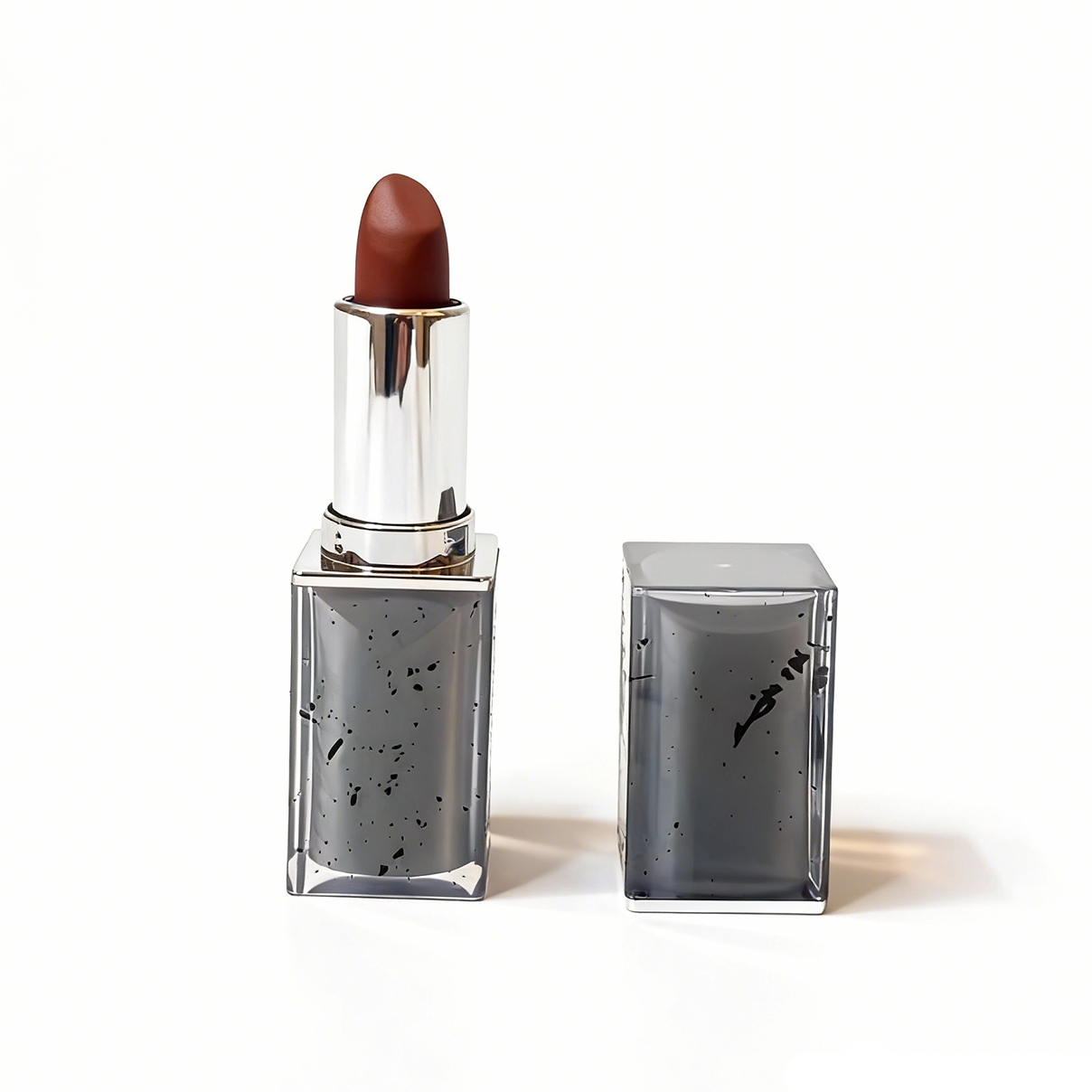 Single square lipstick tube showing black ink dots detail. Premium wholesale cosmetics by MCcosme.