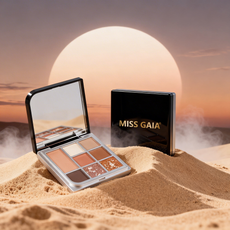 High-quality photography of a warm sunset tone makeup palette in the sand. MCcosme is a top B2B cosmetic supplier.