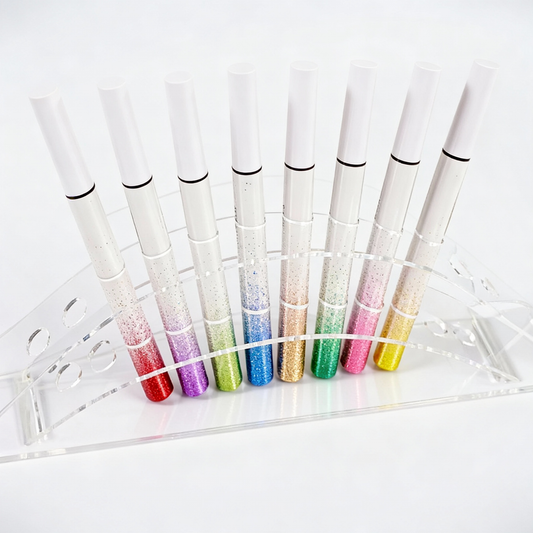 Front display of wholesale glitter liquid eyeliner pens in gradient packaging. Available for private label OEM at MCcosme.